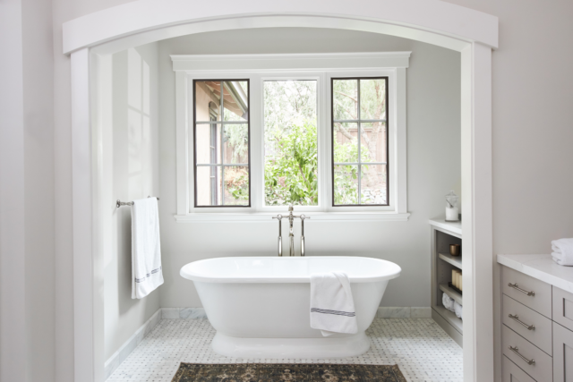 douglah-designs-lafayette-ca-home-renovation-in-sf-bay-area-2023-elegant-freestanding-tub-through-arched-entry-way
